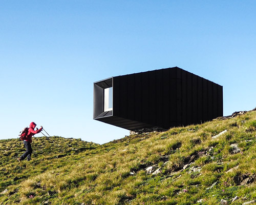the black body mountain shelter frames alpine views in dormillouse, italy