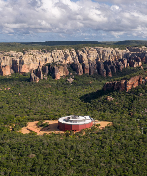 the spiral-shaped 'museu da natureza' is set amid brazil's natural landscape