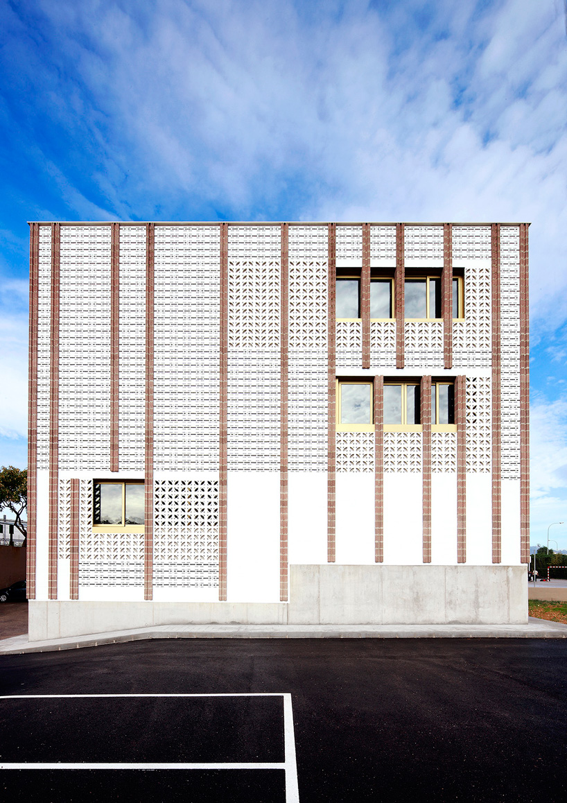 SMS arquitectos wraps high school extension with patterned façade in mallorca