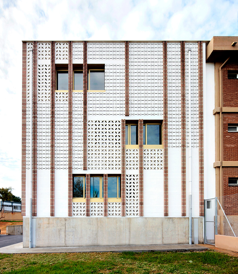 SMS arquitectos wraps high school extension with patterned façade in mallorca