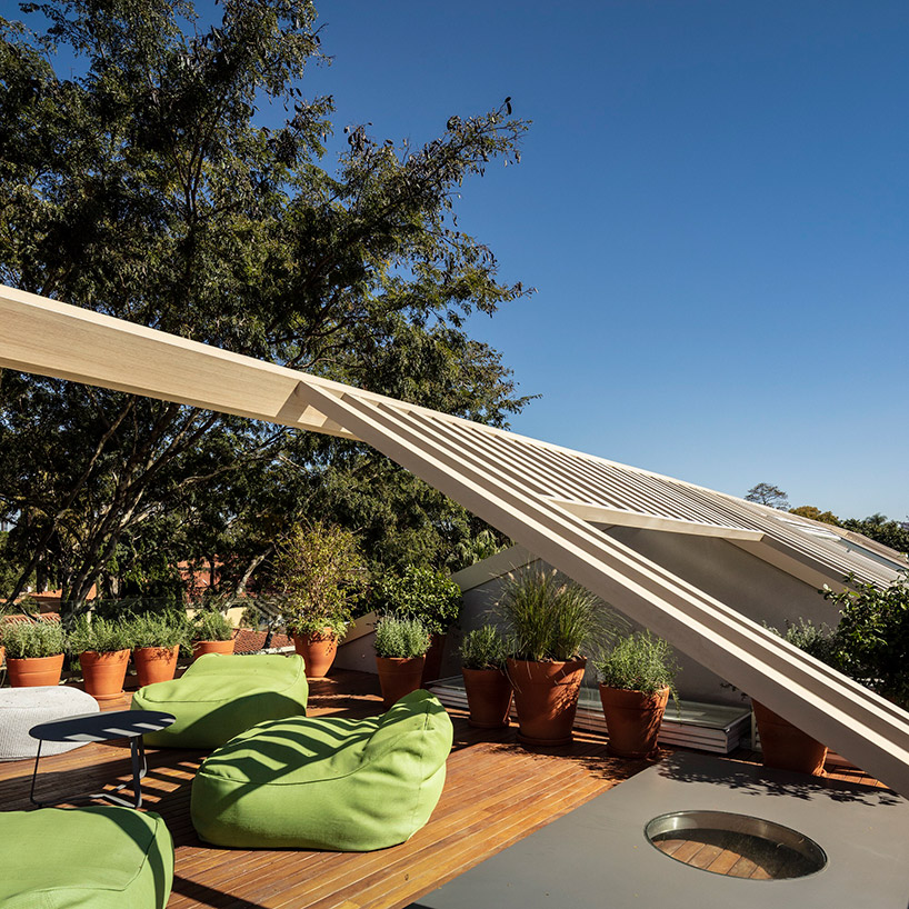 studio AG completes house for young couple with gable roof in sao paulo