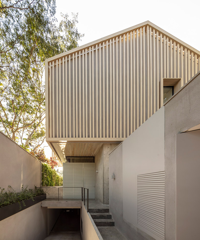studio AG completes house for young couple with gable roof in sao paulo