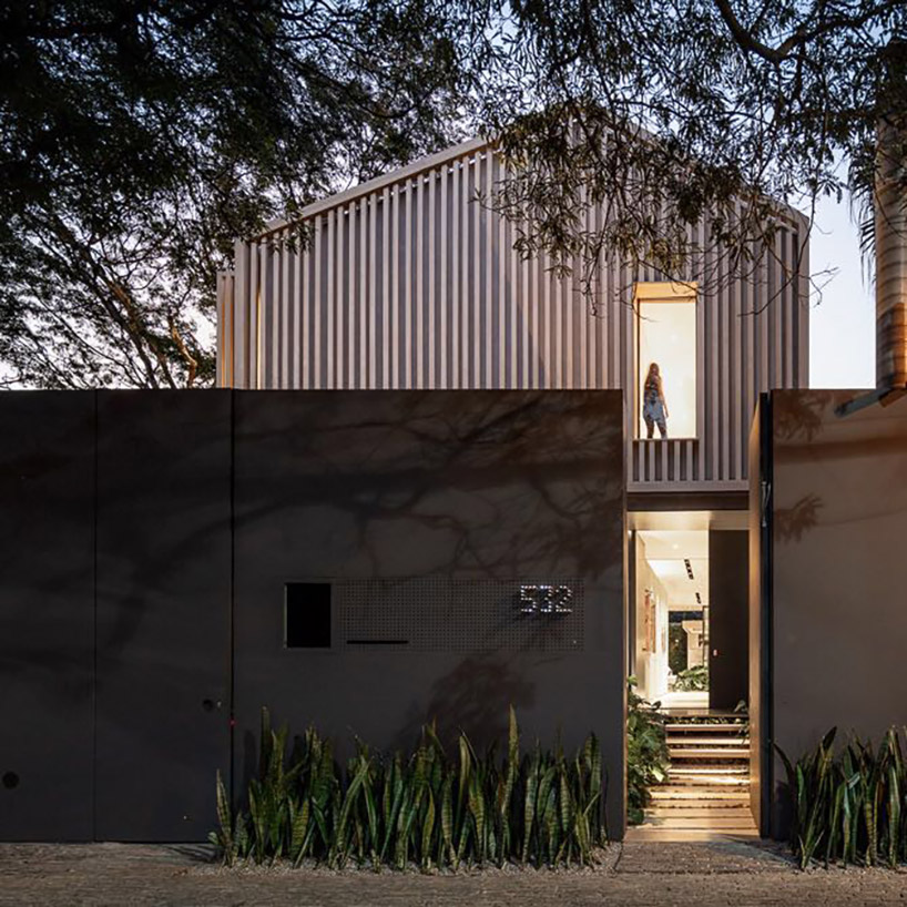studio AG completes house for young couple with gable roof in sao paulo