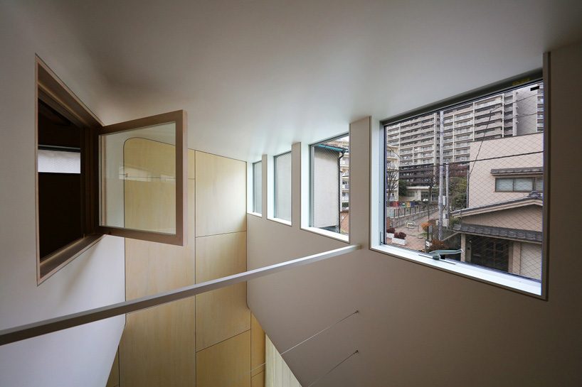 sugawaradaisuke combines living space + community café in 'light surface house' in tokyo