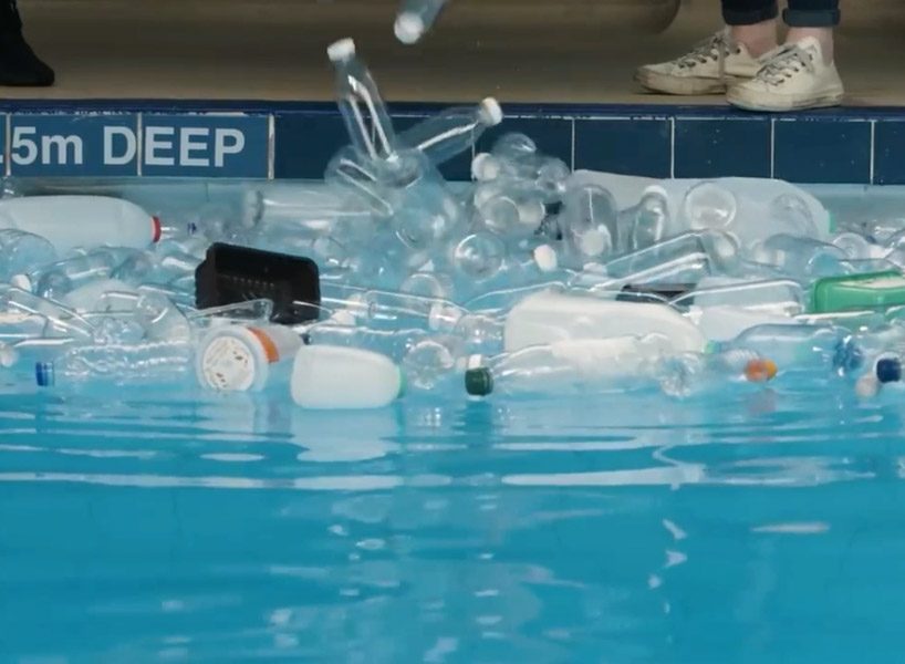 synchronized swimmers in a pool full of rubbish raise awareness of plastic pollution designboom