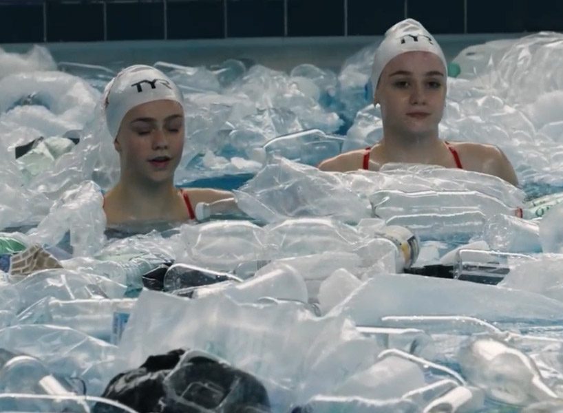 synchronized swimmers in a pool full of rubbish raise awareness of plastic pollution designboom
