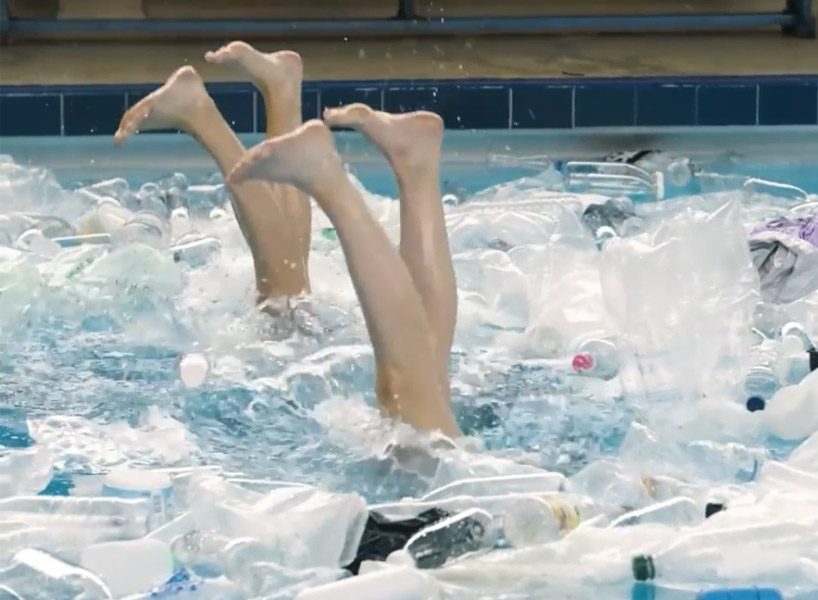 synchronized swimmers in a pool full of rubbish raise awareness of plastic pollution designboom