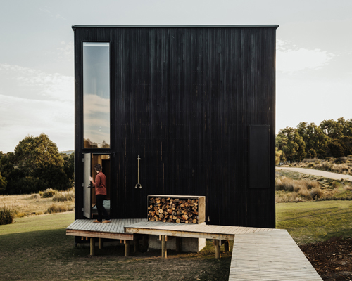 taylor + hinds architects builds tiny black cabin retreat in tasmania