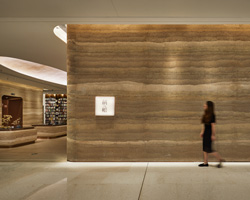 tomoko ikegai / ikg inc encloses 'yan' bookstore in shenzhen using rammed-earth walls