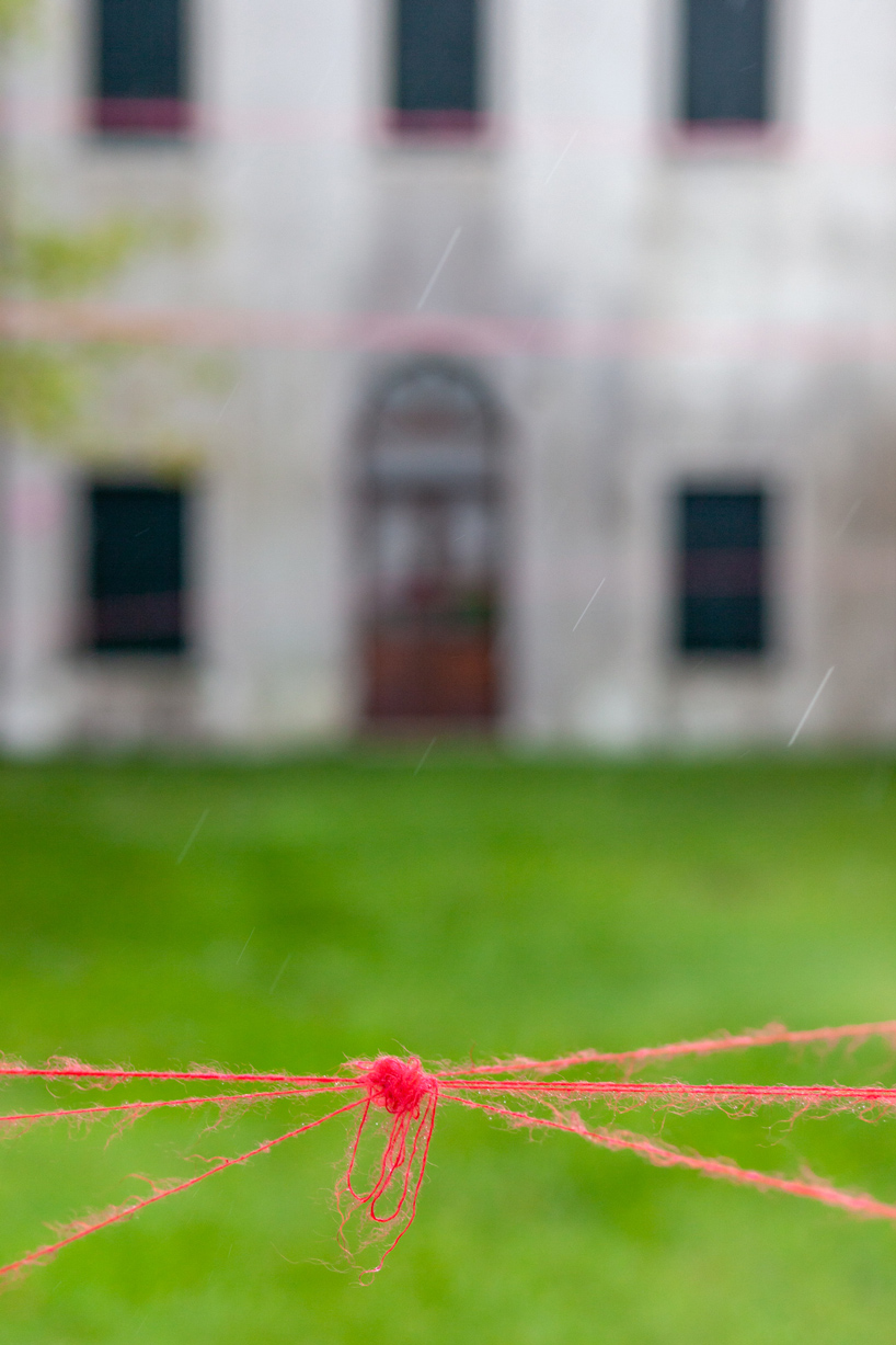 uemon ikeda conveys the fragile and vulnerable beauty of venice with delicate red thread
