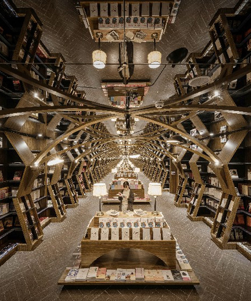 x+living combines wooden structures and mirrors in mesmerizing chinese bookstore