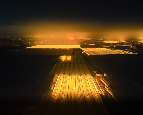 tom hegen captures illuminated aerial photographs over promising dutch greenhouses