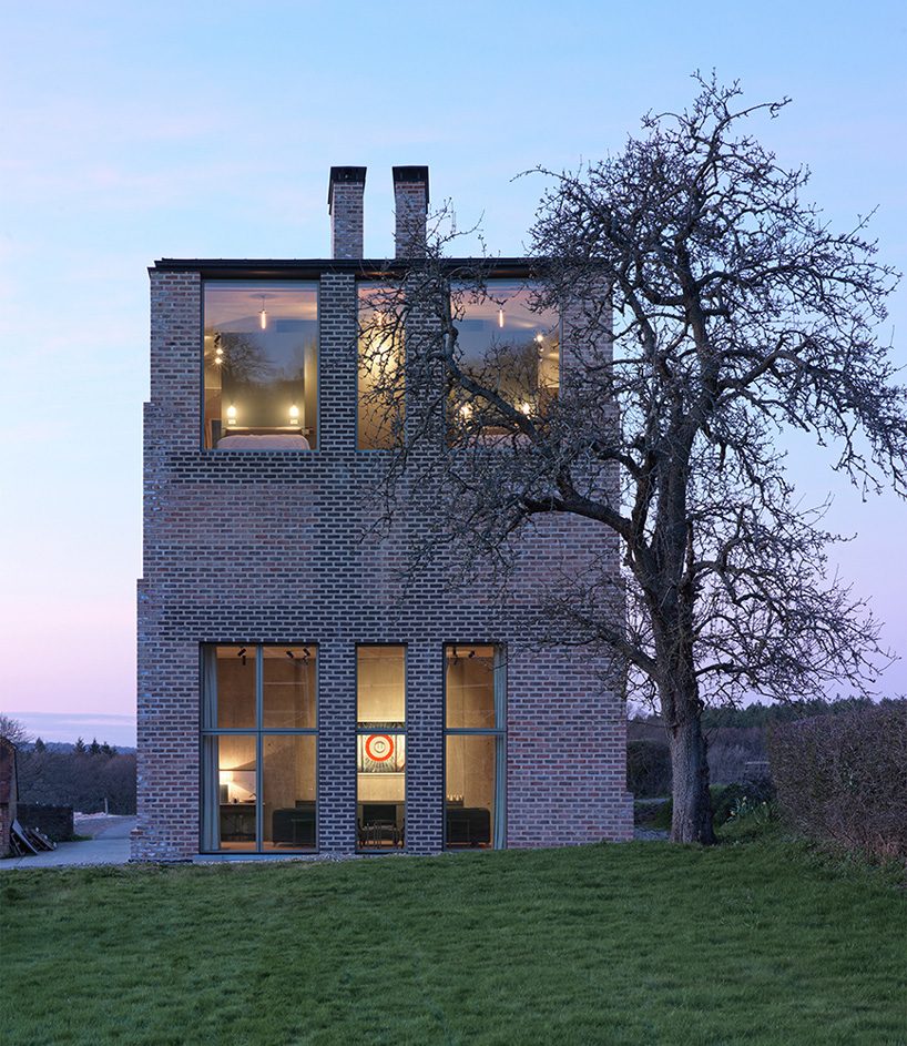 adam richards builds his own home, nithurst farm, in sussex with arched brick windows