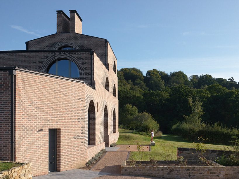 adam richards builds his own home, nithurst farm, in sussex with arched brick windows