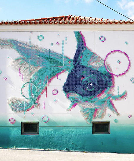 cross-stitch street art: portuguese artist combines digital and analog design