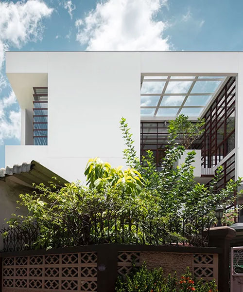 anonym studio merges indoor and outdoor space to create tree house in bangkok