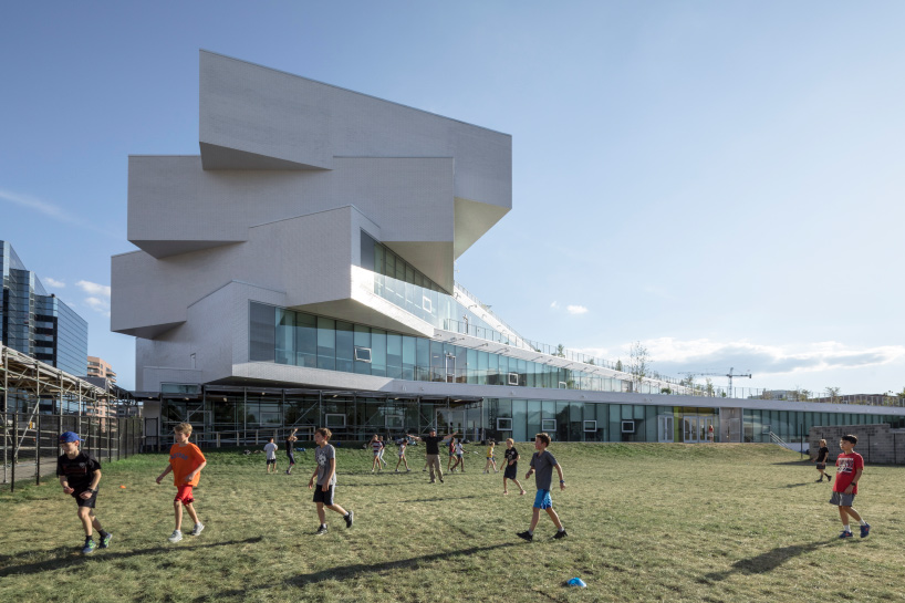 bjarke ingels group's first public school in the US features cascading green terraces