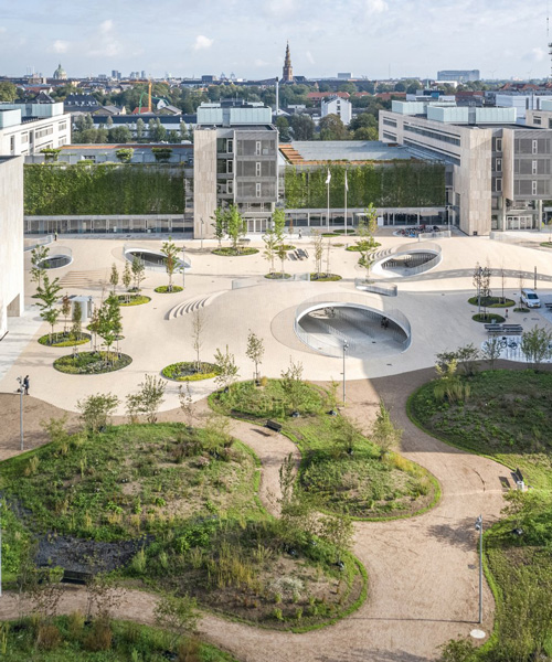 COBE architects' karen blixens plads is an urban plaza of bicycle hills + plants in copenhagen