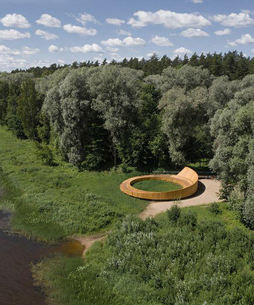 DJA winds a wooden path and viewing terrace through forest in latvia