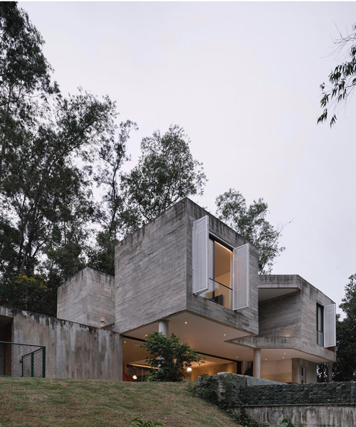 estúdio BRA's pitanga house sits within the rich native vegetation of santa isabel, brazil