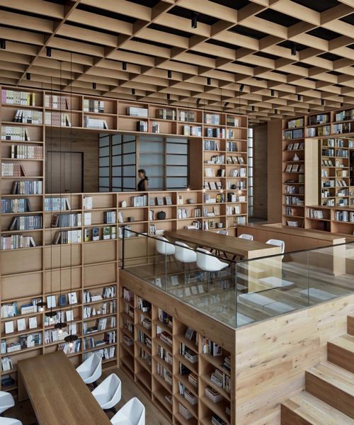 beijing fenghemuchen space design builds yue library as wooden forest of books in hangzhou