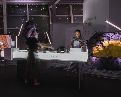 ENORME studio designs an outer space-like exhibition featuring nine 'astral bodies'