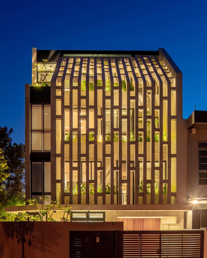 HYLA architects wraps singapore house in perforated screens of different patterns
