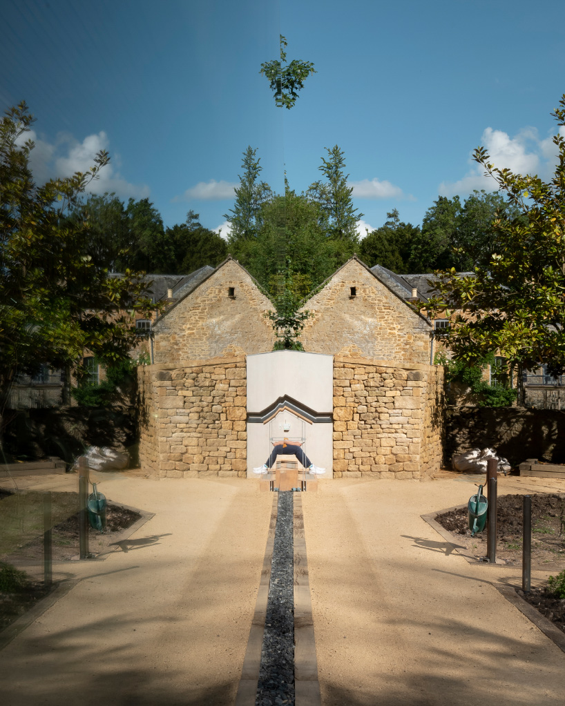 invisible studio designs hotel gym overlooking productive garden