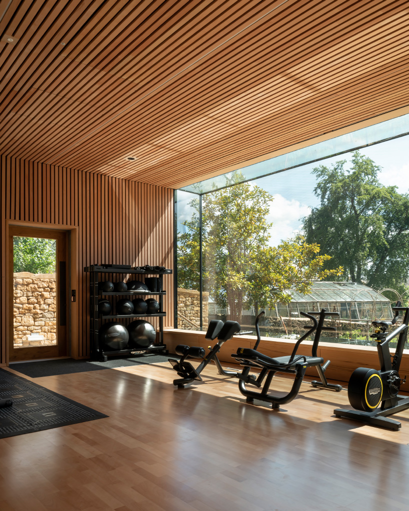 Invisible Studio Designs Hotel Gym Overlooking Productive Garden