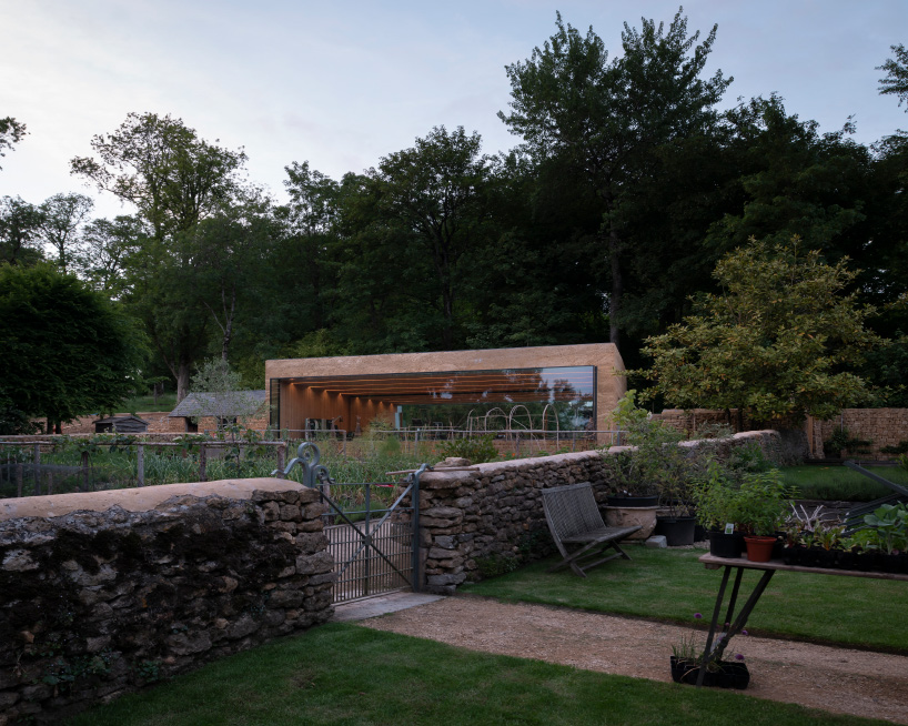 invisible studio designs hotel gym overlooking productive garden