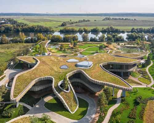 green roofs melt j.mayer.h's n.n. residence into the rolling hills of rural moscow