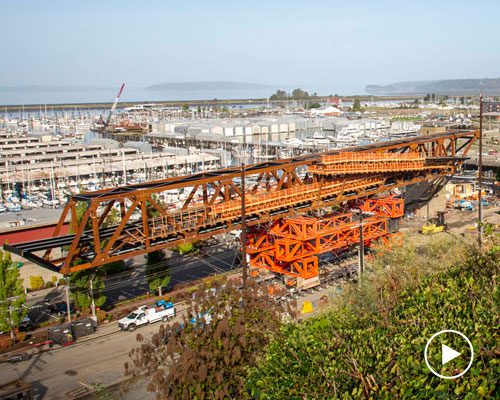 LMN architects utilizes weathered steel trusses to build pedestrian bridge in washington