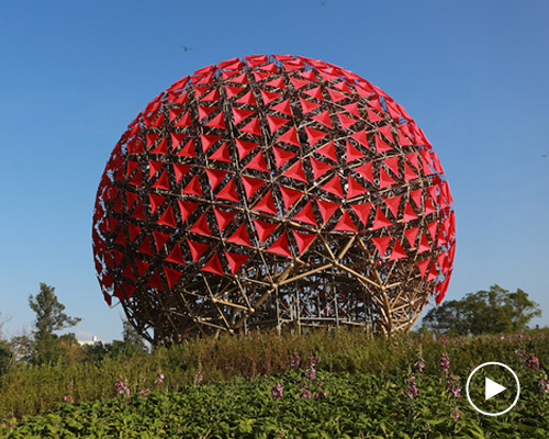the sound of blooming is a moving installation made up of 697 red flowers in taichung