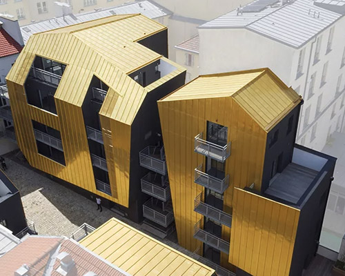 golden standing seam panels clad metek architecture's social housing project in paris