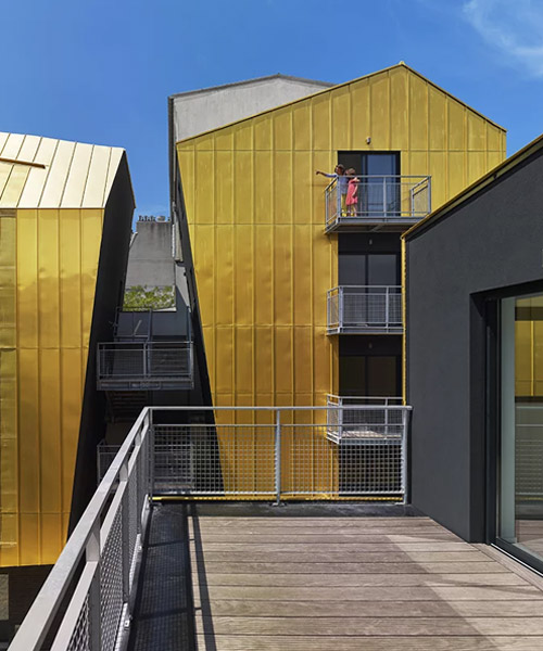 golden standing seam panels clad metek architecture's social housing project in paris