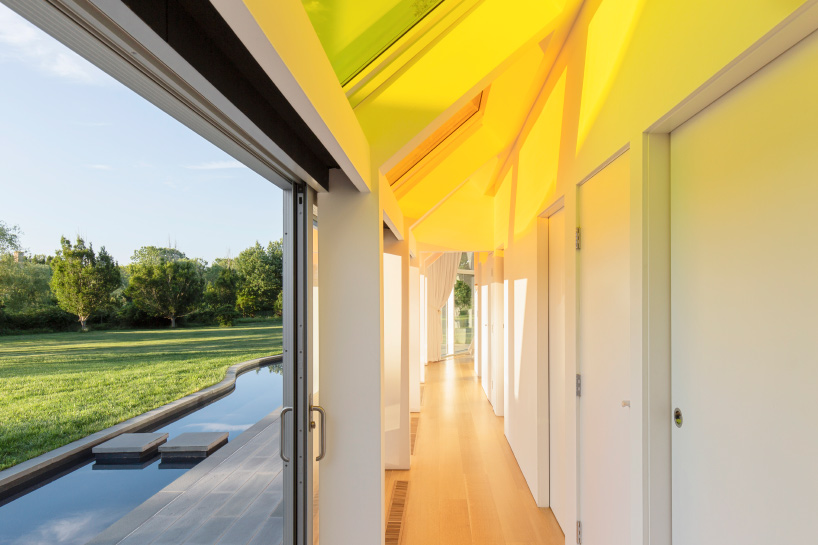 cocoon cottage in the hamptons filters sun through colored skylights