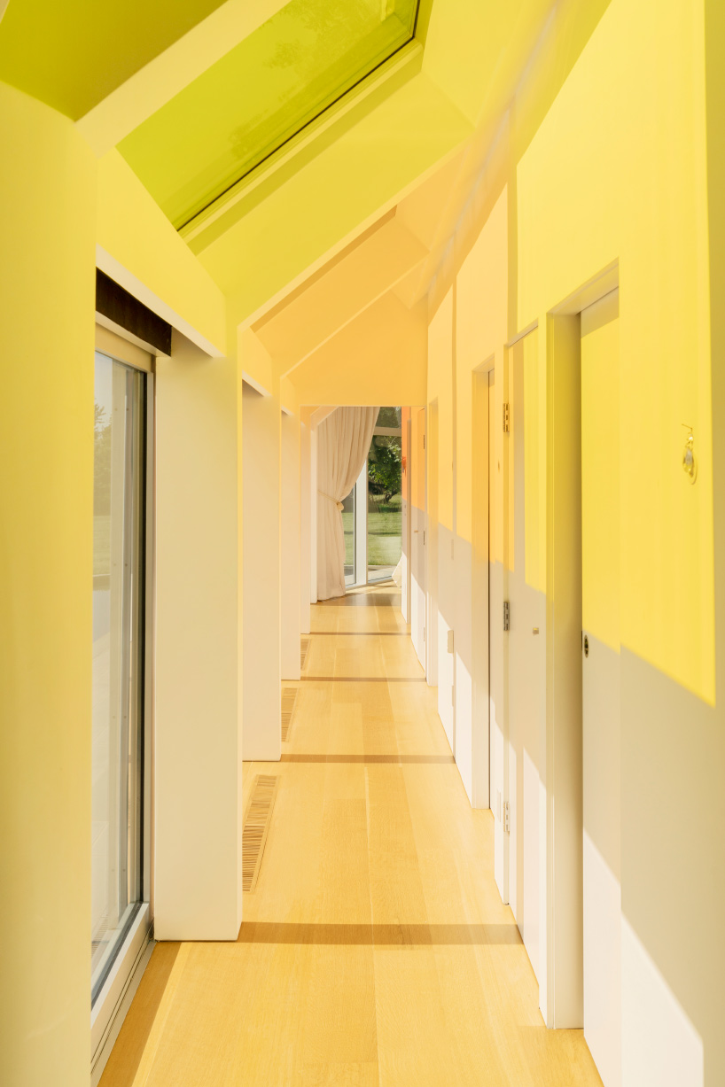 cocoon cottage in the hamptons filters sun through colored skylights
