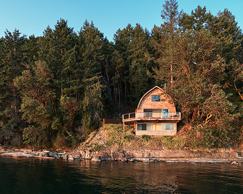 patrick powers revitalizes the acorn cabin overlooking pacific northwest islands