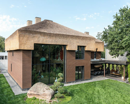 a thatched roof tops MAKHNO studio's shkrub house in the suburbs of kiev