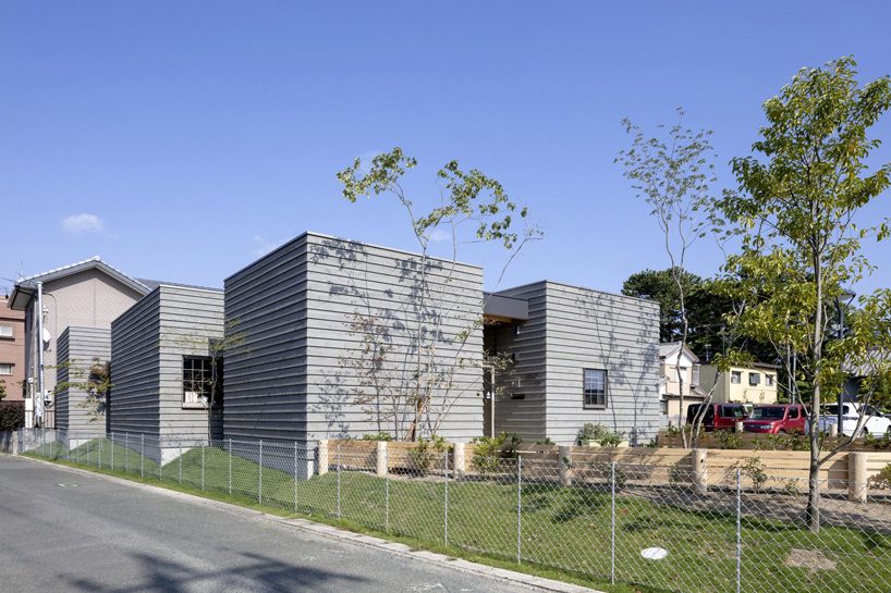 SN design architects combines individual cubes into the enoki nursery school in japan