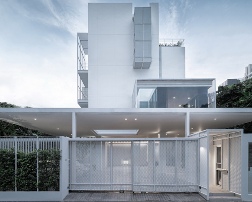 Stu/D/O wraps baan 33 apartment in expanded aluminum + solid walls in bangkok