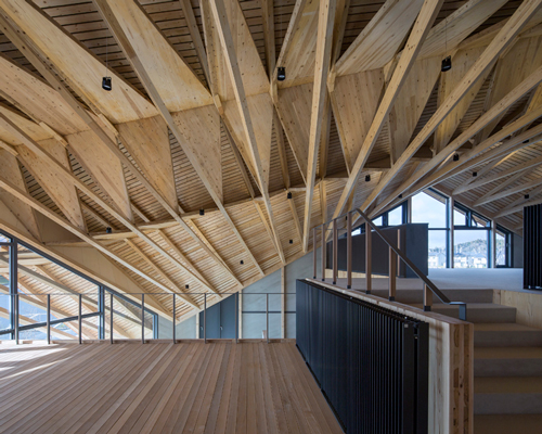 UENOA tops japanese office building with three-dimensional timber roof