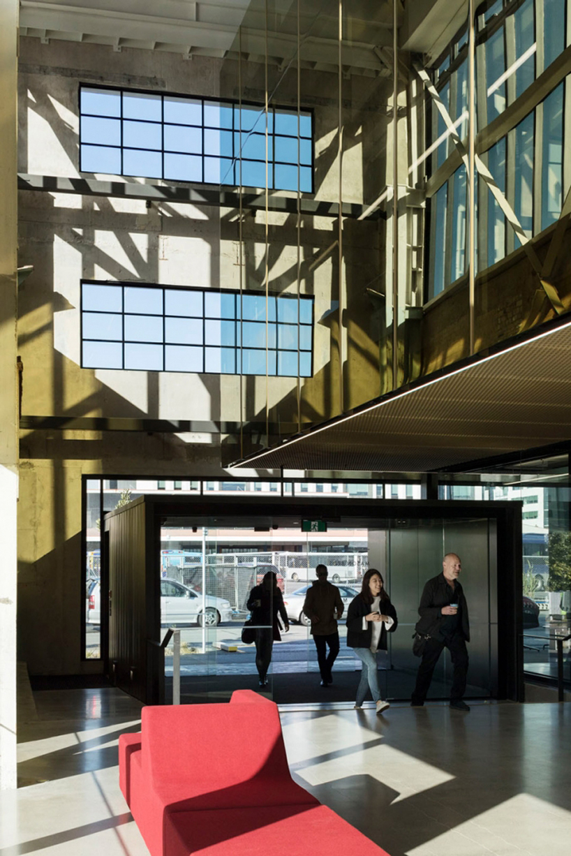 warren and mahoney transforms new zealand warehouse into three-story office building