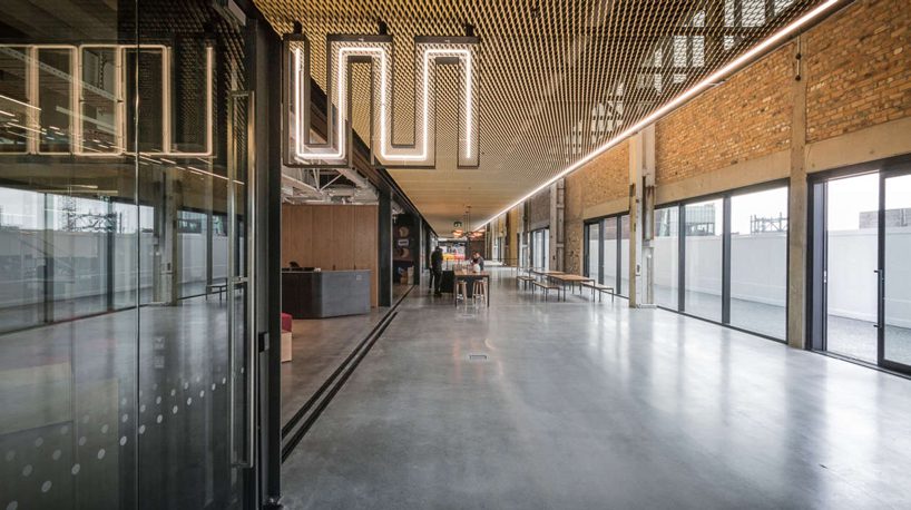 warren and mahoney transforms new zealand warehouse into three-story office building