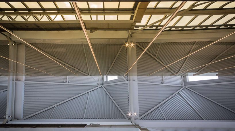 warren and mahoney transforms new zealand warehouse into three-story office building