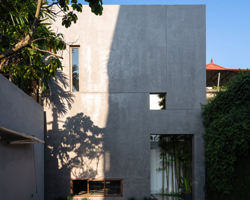 AHL encloses the living areas + courtyards of 8x24 house in vietnam using a concrete shell