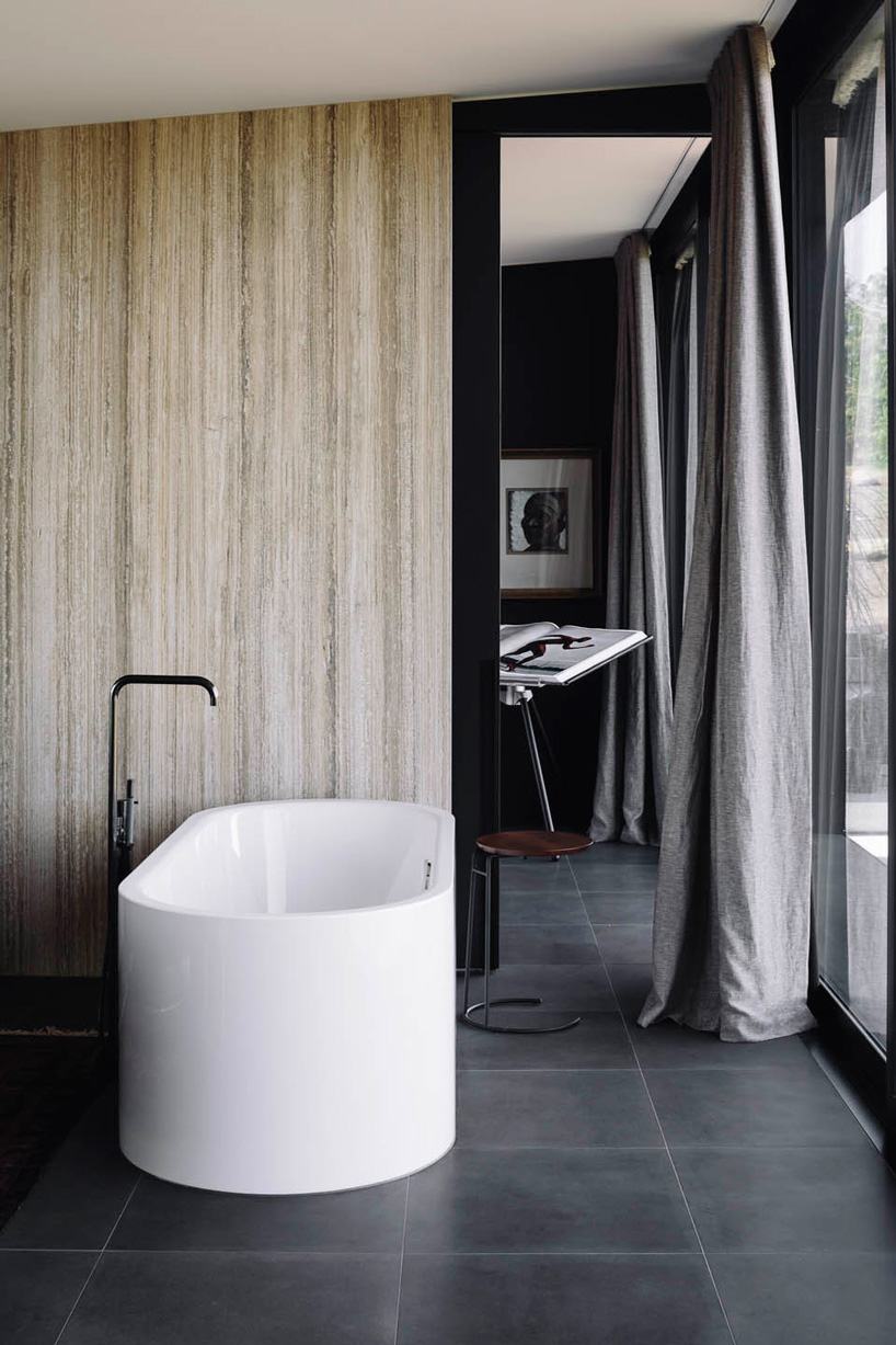 fearon hay architects builds house in new zealand's alps as cluster of blackened volumes