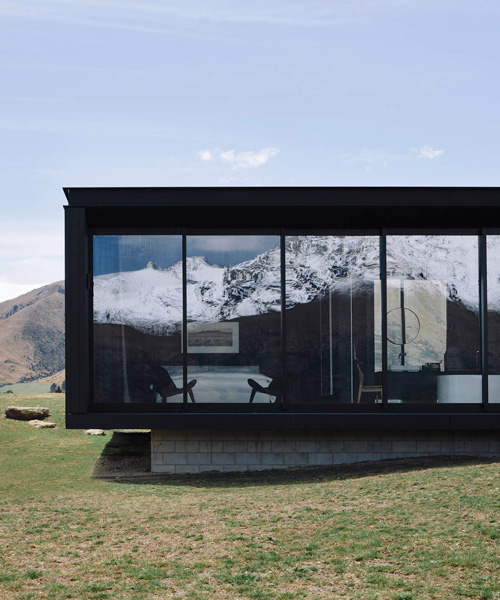fearon hay architects builds house in new zealand's alps as cluster of blackened volumes