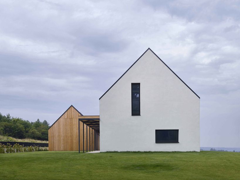 ARCHITEKTI mikulaj & mikulajova’s rural house in slovakia combines two gable roof volumes