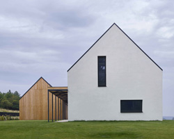 ARCHITEKTI mikulaj & mikulajova's rural house in slovakia combines two gable roof volumes